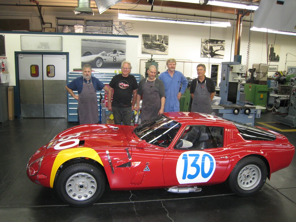 A team portrait after completing the Alfa Romeo TZ2 restoration