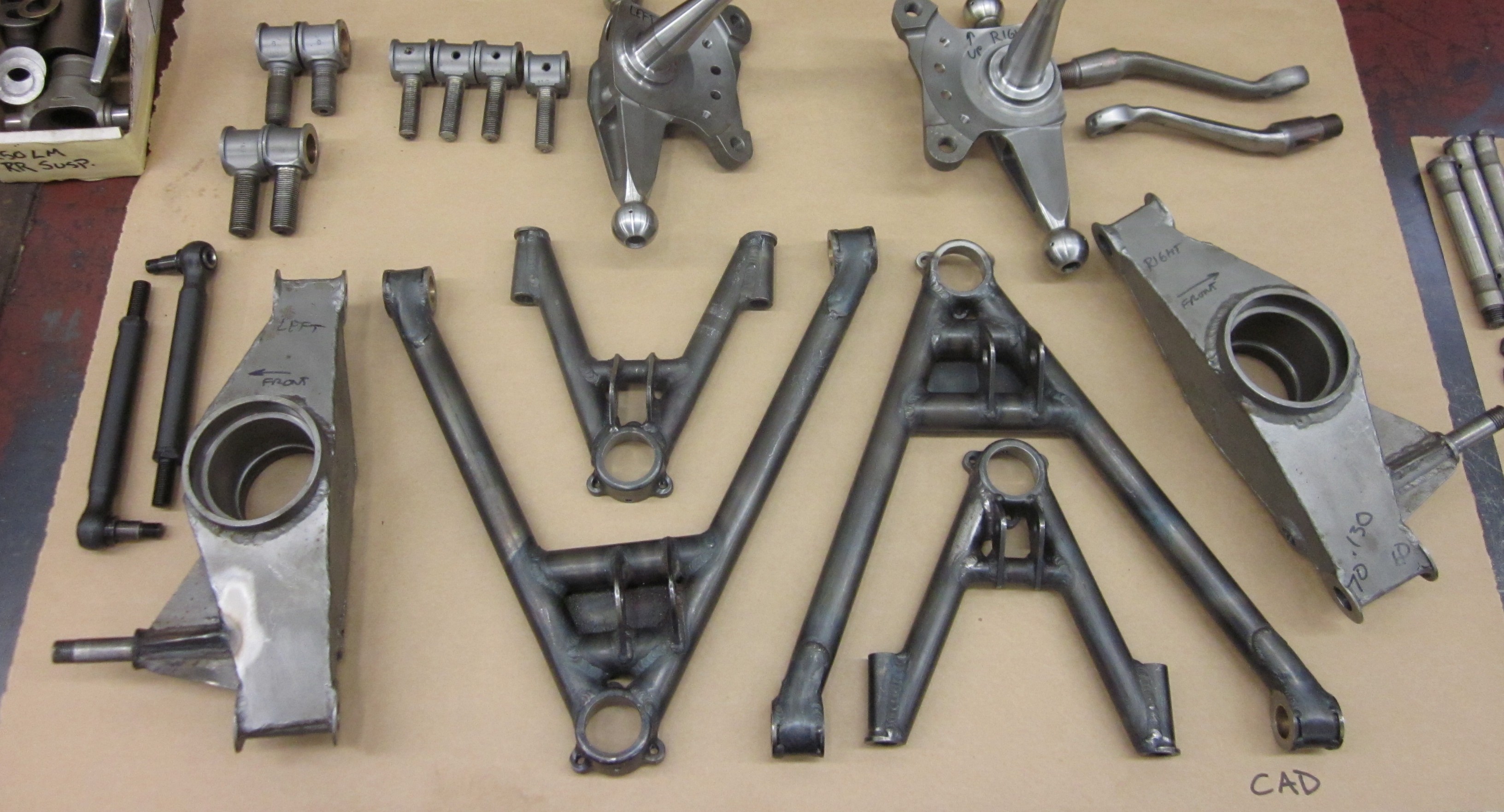 Assorted Ferrari parts laid out for refinishing